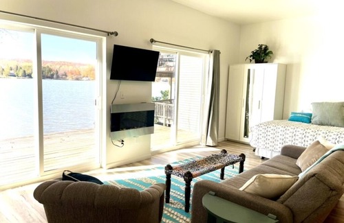 Hancock Apartment | Bliss Shores: Sunset Studio Suite - Waterfront with Wraparound Deck