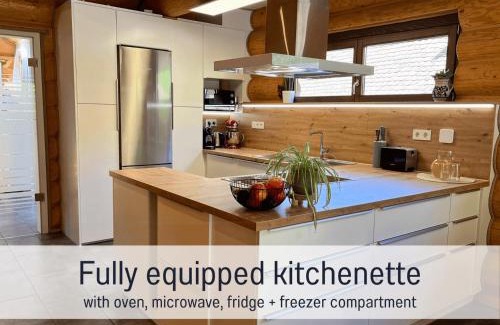 Laslea House | Blockhaus Malmkrog with garden, bright rooms, and an open kitchen