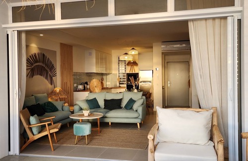 Paea Apartment | bohemian chic atmosphere with beach access and private swimming pool.