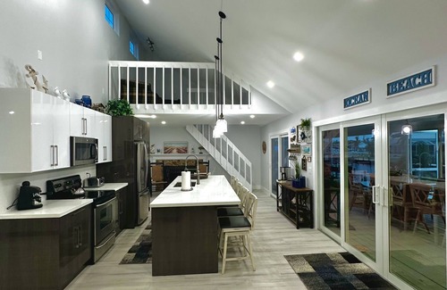 Gulf Cove House | Breath taking canal, pool home with golf access. 15 minutes from beaches.