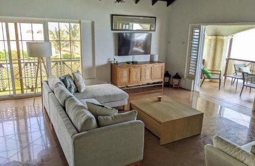 Oistins Apartment | Breezy Ocean Front Condo Close to The Best Beaches