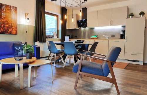 Elpe Apartment | Bright apartment for 6 people on the ground floor with a terrace in the garden right by the forest