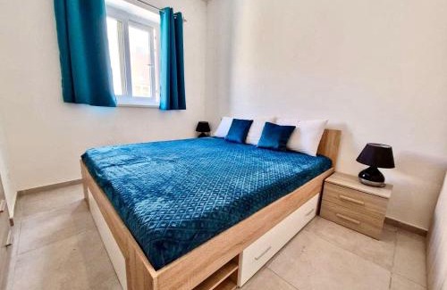 Qawra Apartment | Bright & Central with Parking, Indoor Pool & Gym
