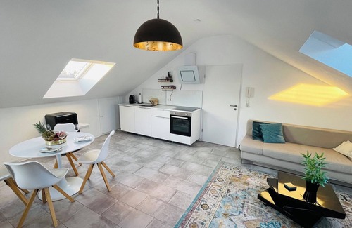 Karthause Condo | Bright, spacious attic apartment.