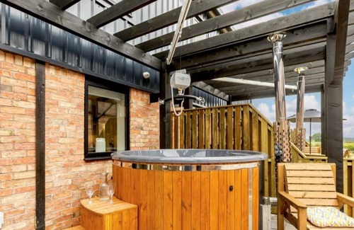 Moreton Valence Cottage | Buck Cottage. Purpose-built, disabled adapted, with hot tubs