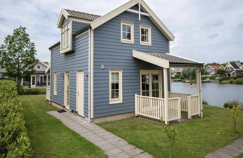 Municipality of Nissewaard House | Bungalow by Water with Sauna in South Holland