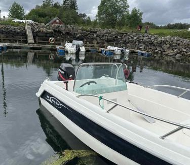 Aure House | Cabin at the end of Skardsøya towards the sea - boat