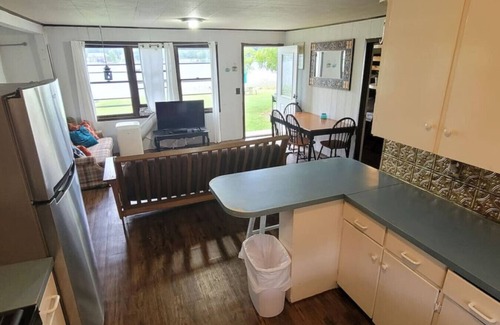 Alto House | Campau Lake Sunshine Cottage with Tiki game house 4 King Beds