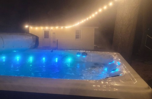 Alto House | Campau Lake Sunshine Cottage with Tiki game house 4 King Beds