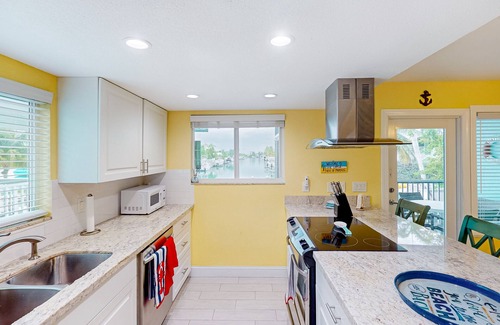 Key Colony Beach House | Canal-front duplex with Cabana Club membership, private dock, canal views, grill