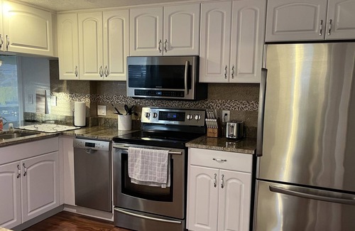 Hudson Beach Estates House | Canal front home minutes to Gulf of Mexico with back yard oasis.