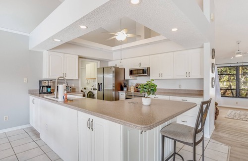 Pebble Beach House | Canal-front home with sandy beaches, golf courses, dock, & refreshing pool