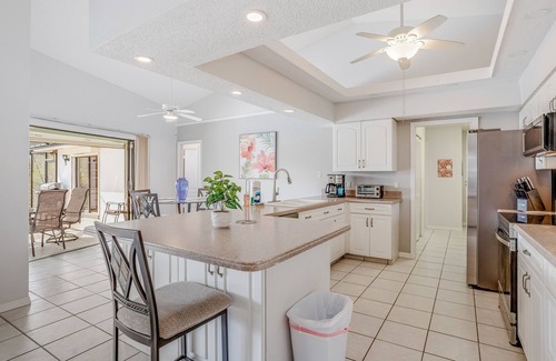 Pebble Beach House | Canal-front home with sandy beaches, golf courses, dock, & refreshing pool