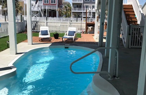 Ocean Isle Beach House | Canal Front w/Putting Green w/private dock & private heated pool; Sleeps 18+