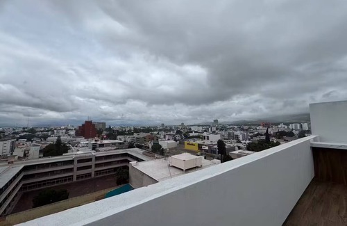 San Luis Potosi Apartment | Carranza Views! Heated Pool, KingBed & WorkSpace