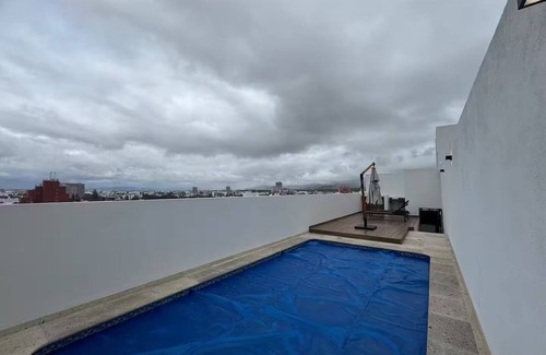 San Luis Potosi Apartment | Carranza Views! Heated Pool, KingBed & WorkSpace