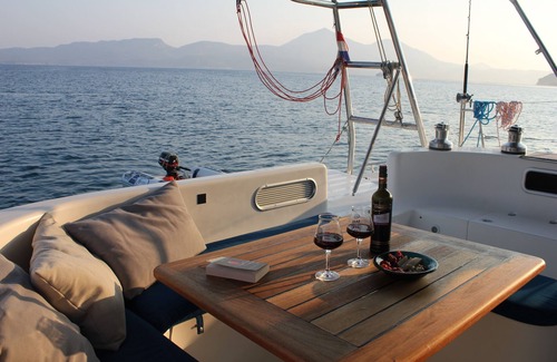 Vlychada Boat Rental | Catamaran cruise with skipper and hostess