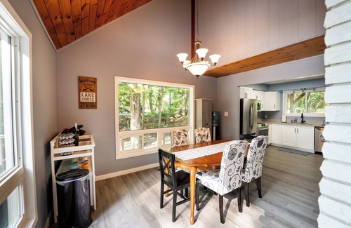 Minden Hills Cottage | Cedar and Sand Lakehouse on Lake Kashagawigamog | Fireplace | Firetable | Dock
