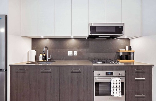 Eau Claire Apartment | Central Calgary Riverside Haven