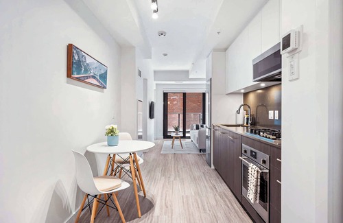 Eau Claire Apartment | Central Calgary Riverside Haven