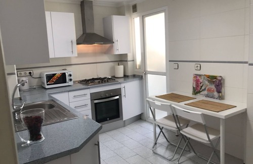 Plaza de Toros Vieja Apartment | Central City Apartment Canales with Wi-Fi, Air Conditioning & Balcony; Garage Available