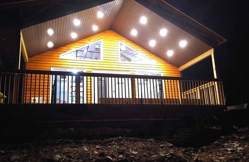 Queens House | Chalet directly on the lake, central storage, incl. access to private island