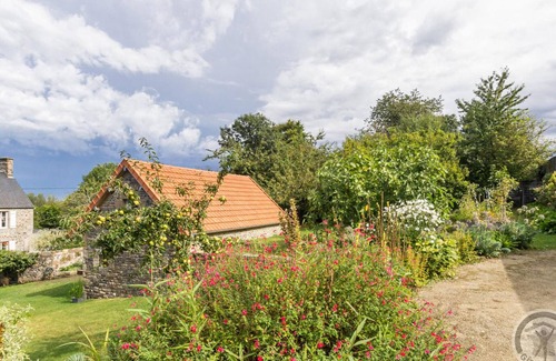 Jullouville Cottage | Charming Cottage with Terrace, Garden, and Bikes Near Beautiful Sandy Beach