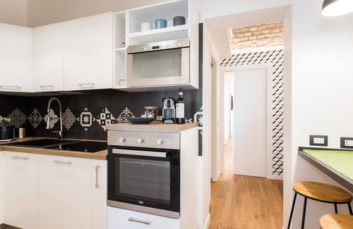 Trastevere Apartment | Charming house for 5 in Trastevere overlooking medieval church: 3 bathrooms, WiFi,AC
