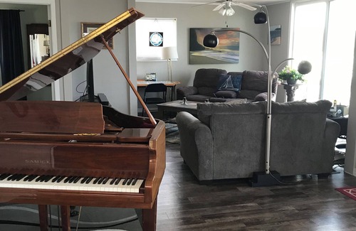 Sheridan House | Charming lakefront cottage with baby grand piano to use by qualified renters.