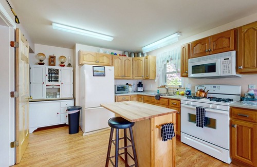 Norway House | Charming lakefront home with water views, dock & inviting deck, Central A/C