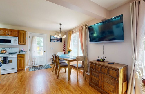 Norway House | Charming lakefront home with water views, dock & inviting deck, Central A/C