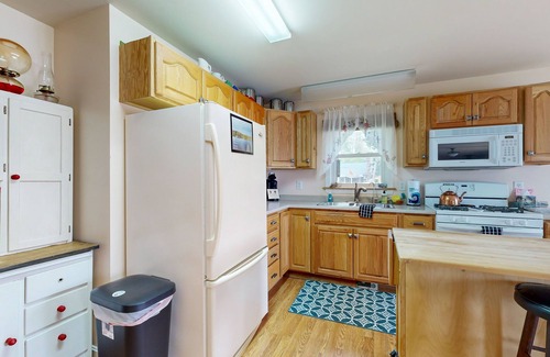 Norway House | Charming lakefront home with water views, dock & inviting deck, Central A/C