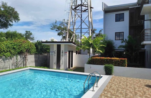 Talisay Condo | Charming Mel's Place -1bedroom condo near SM Seaside with AC, WiFi & Netflix