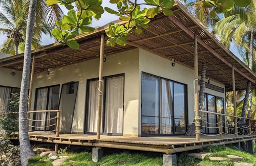 Palomino Villa | Charming oceanfront cabin with stunning views, private terrace, and beach access