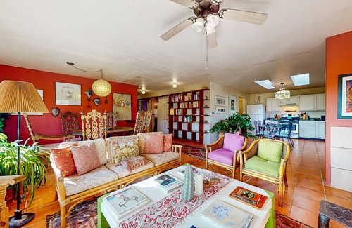 Taos House | Charming secluded home mountain views, covered front porch, & book collection