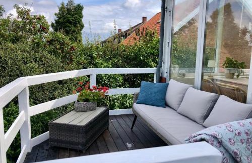Randers Apartment | Charming sunroom with panorama view