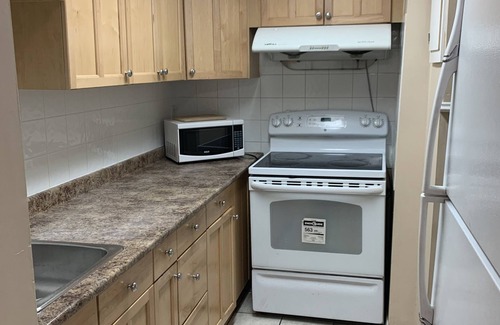 Southeast Calgary House | Cheerful 2 bedroom townhome with fireplace