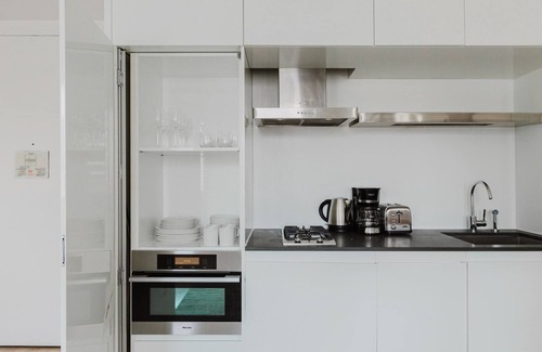 Central New York City Apartment | Chic Midtown 2BR w/Gym, W/D & A/C, near Rock Ctr, by Blueground