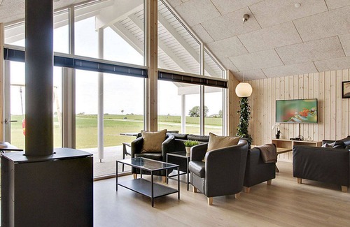 Skastrup Strand House | Chic pool and activity house with 5 bedrooms, 2 bathrooms, fireplace and WiFi