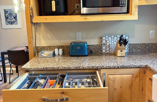 Central Colorado Springs House | CLEAN, COMFORTABLE, and CHARM! Guests love our hot tub, gas grill and fire-pit!