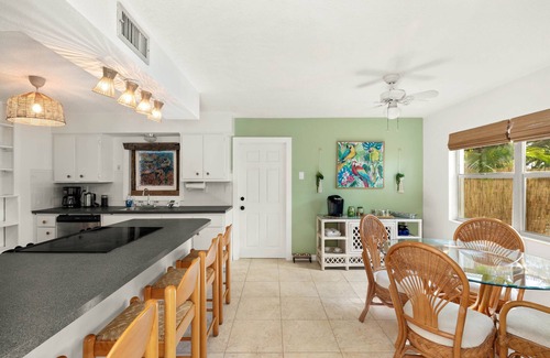 River Isles House | Coconut cove - peaceful garden retreat with HEATED pool on canal near the beach!