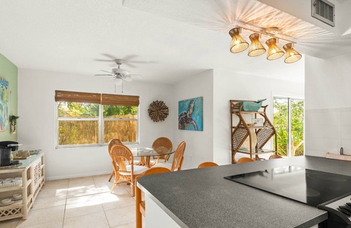 River Isles House | Coconut cove - peaceful garden retreat with HEATED pool on canal near the beach!