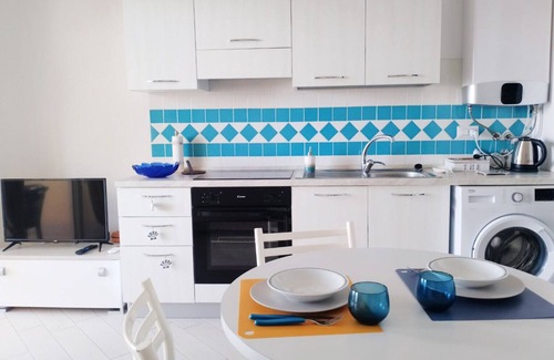 Paduledda Apartment | Comfortable one-bedroom apartment with wide sea view, shared pool and parking space