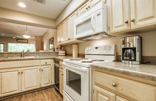 New Braunfels Condo | Comal Riverfront with 2 decks! Schlitterbahn! Pool, hot tub & river access!