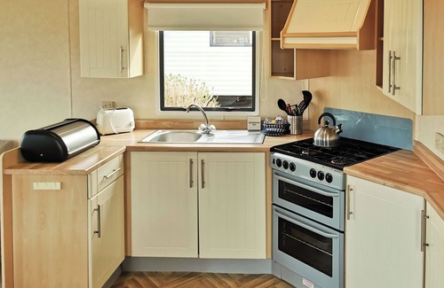Ludchurch House | Comfortable and spacious 12ft-wide caravan with one double and one twin.