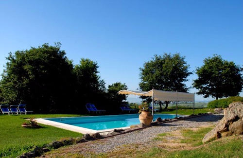 Radicofani Apartment | Comfortable apartment with garden in an old farmhouse with swimming pool