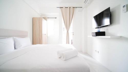 Surabaya Apartment | Compact and Tidy Studio at Puncak Dharmahusada Apartment By Travelio
