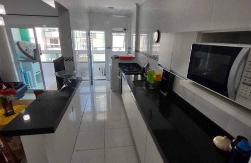 Praia Grande Apartment | Complete apartment with sea view, 1 block from the beach and 1 parking space