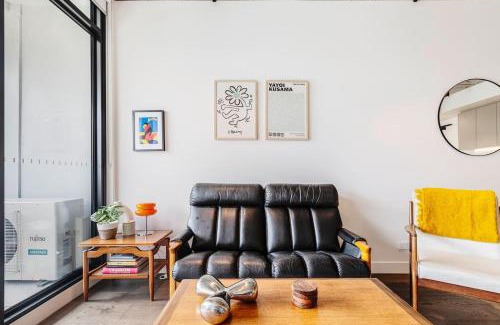 Brunswick Apartment | Concrete Junction - Sunny, Industrial Balcony Haven