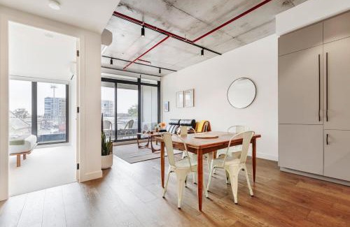 Brunswick Apartment | Concrete Junction - Sunny, Industrial Balcony Haven